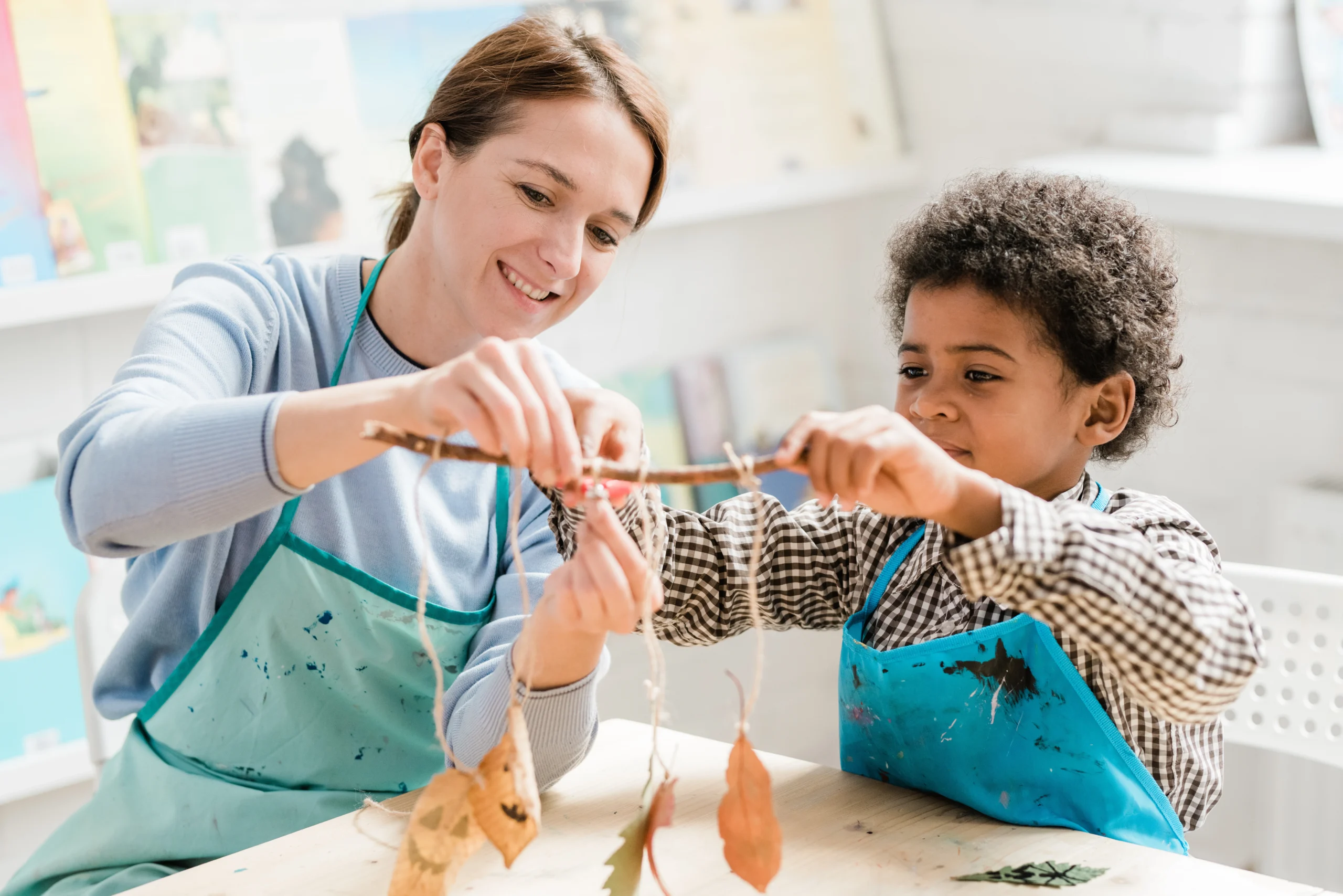 Woman and child crafting a nature mobile 2026 01 08 21 52 37 utc